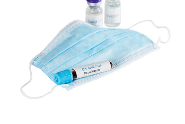 istock Coronavirus Blood Sample with disposable face mask 1311170860