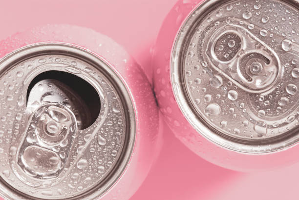 pink soda cans in water drops, top view - cocktail alcohol wine beer imagens e fotografias de stock