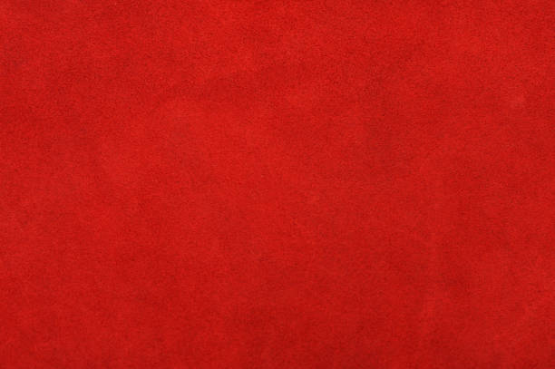 istock Red Background. Red leather texture background. Red fabric in daylight as a material for designers. Suede 1311171907