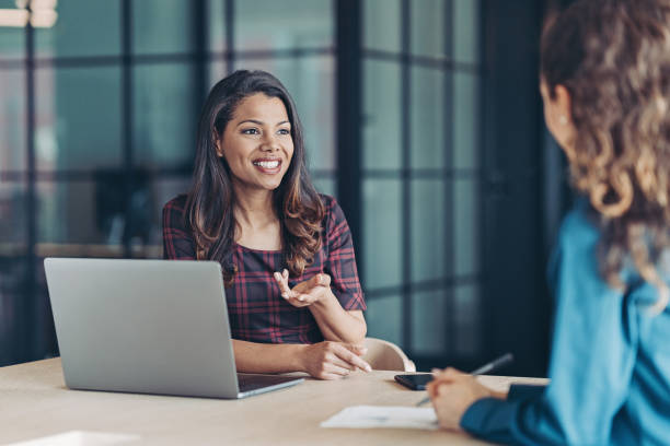 istock Two businesswomen talking 1311174226