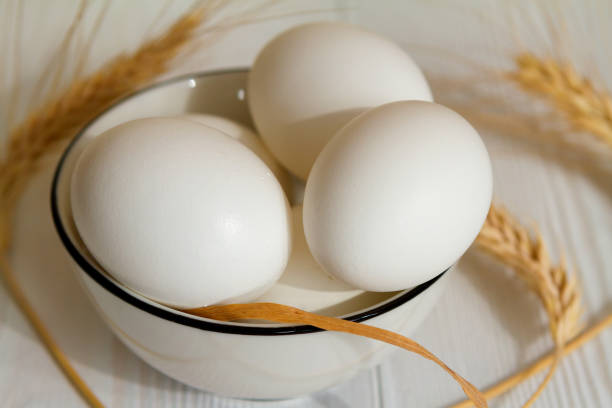 istock White eggs in a bowl on a wooden table 1311174965
