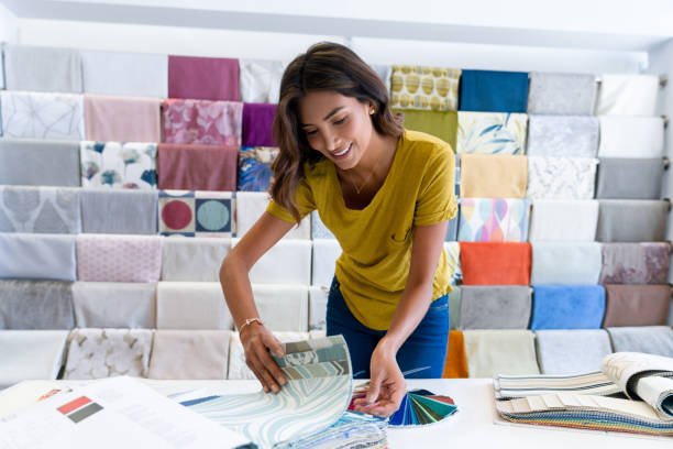 istock Happy woman buying fabrics at a store 1311178352