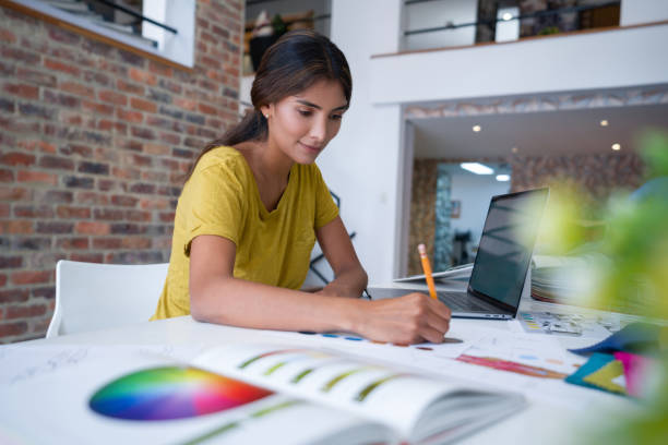 istock Designer working at a creating office drawing some sketches 1311178403
