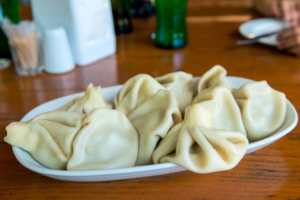 istock Georgian dumplings Khinkali with meat and papper, on white plate 1311182459