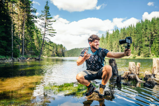 istock Young explorer photographing nature and vlogging. 1311183198