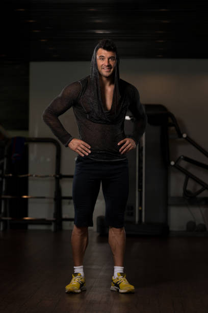 istock Strong Man in Black T-shirt Background Gym 1311186047