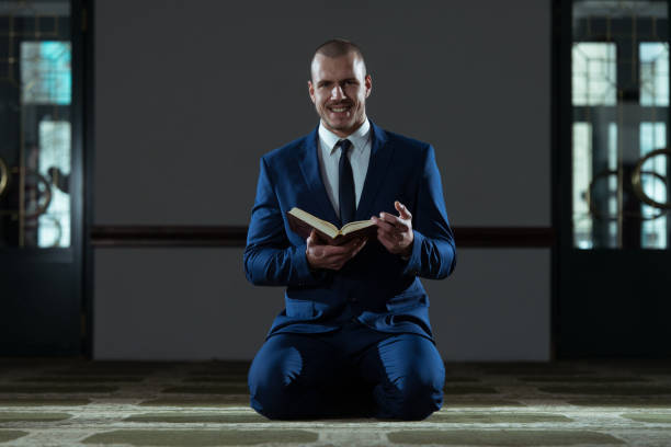 istock Muslim Businessman Is Reading The Koran 1311186085