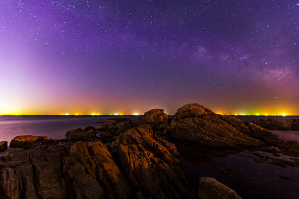 istock sea at night and beautiful Milky Way 1311186176