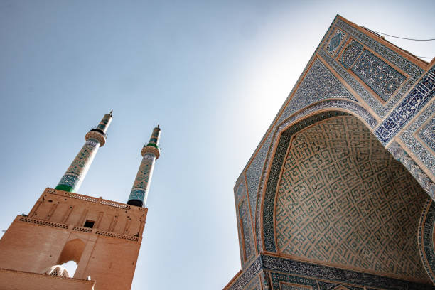 istock Low angle view of a Mosque entrance and its minarates 1311189748