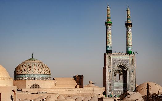 Skyline of an Iranian city center and its mosque. Jameh Mosque of Yazd and residential district in the surroundings