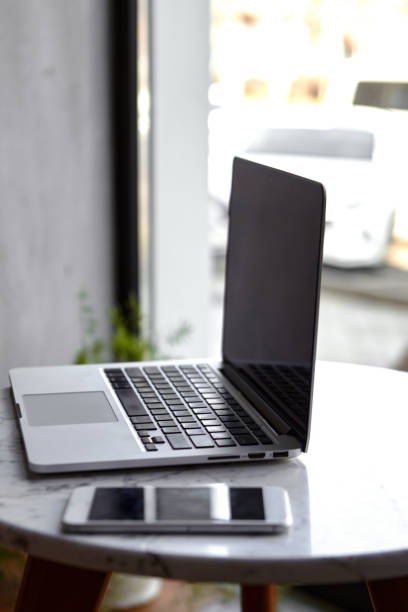 istock Laptop with phone home office 1311190258