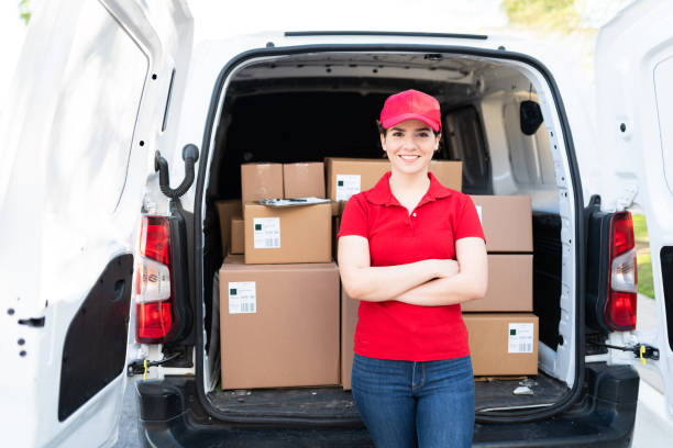 istock Delivery young woman making eye contact while working 1311192224