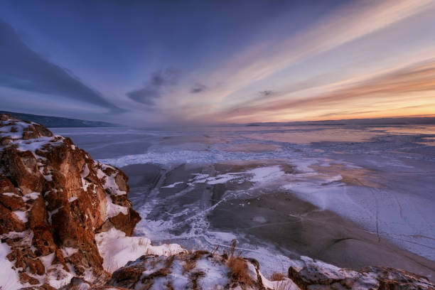 Photo of View above big beautiful frozen lake and mountain in winter, Baikal lake, Russia