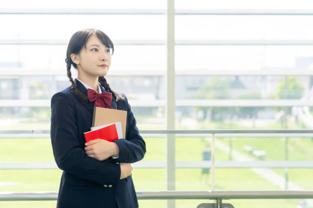 istock Asian female high school student in school building. 1311196736