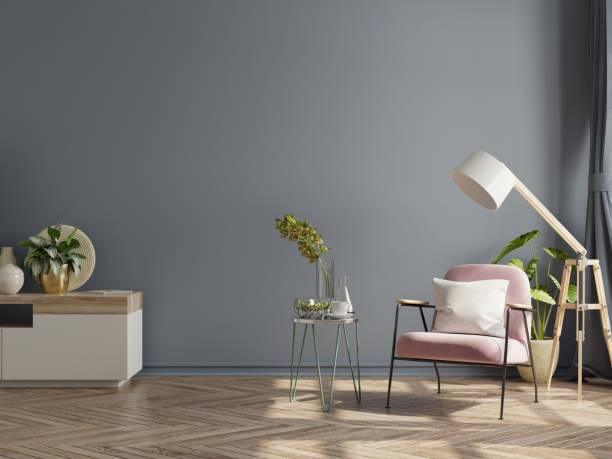 istock Modern minimalist interior with an armchair on empty dark wall background. 1311197052