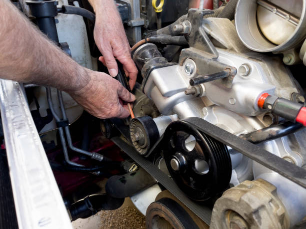 istock human hands with screwdriver working on an automotive engine 1311197690