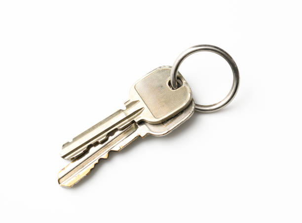 istock Two keys with metal key ring on white background 1311197726