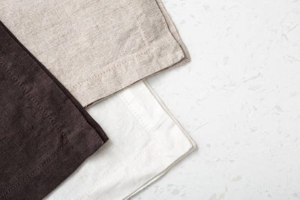 istock Folded linen napkin on marble background 1311201174
