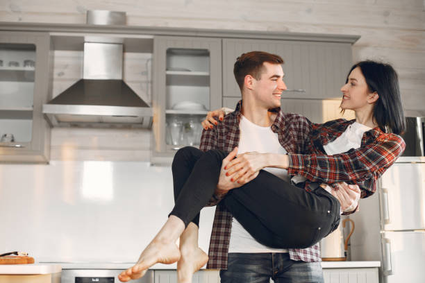 istock Beautiful couple spend time in a kitchen 1311203875