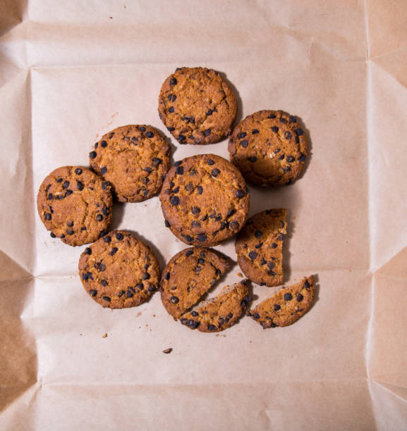 istock Cookies with chocolate icing, on gray packaging paper, copy space, template 1311206069