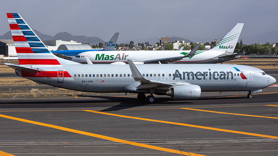 Mexico City, Mexico - April 1, 2021: American Airlines Boeing 737-800, MasAir boeing 767-300F & KLM Boeing 777-200 at Mexico City Intl. Airport.