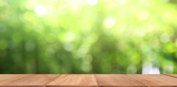istock Wood table display over blur green tree garden 1311207116