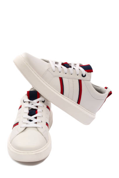istock New white sports sneakers on a white background 1311207972