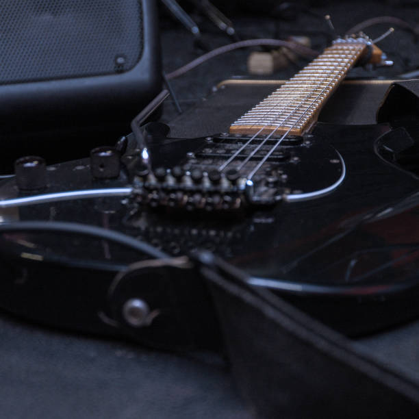 istock Black electric guitar with tremolo on a hard case 1311208758