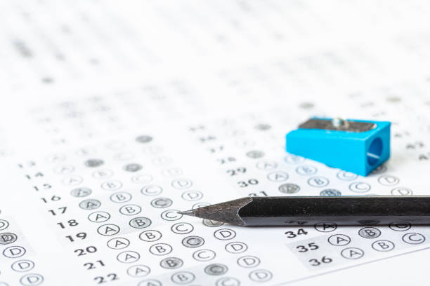 istock testing in exercise and exam paper. computer sheet with pencil in school test room, education concept. filling in answers in pencil 1311214637