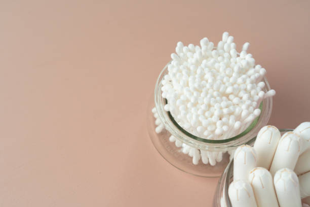 istock Hygienic cotton ear buds in glass cup 1311217670