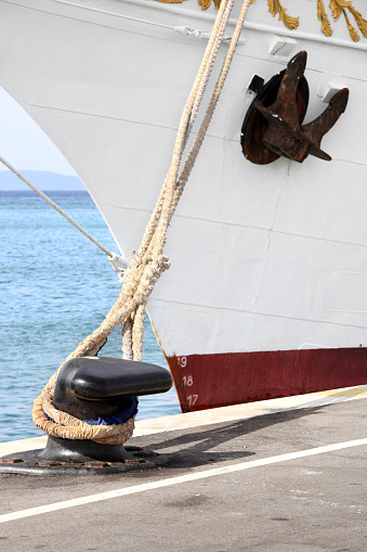 Large sailboat moored in port