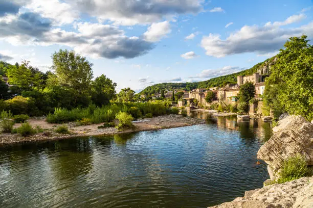 Ardeche river and old village of Vogüé, France
