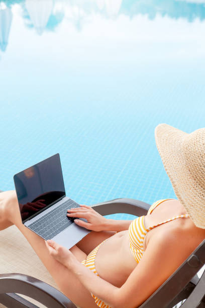 istock Young woman using laptop for remote work or education 1311219778