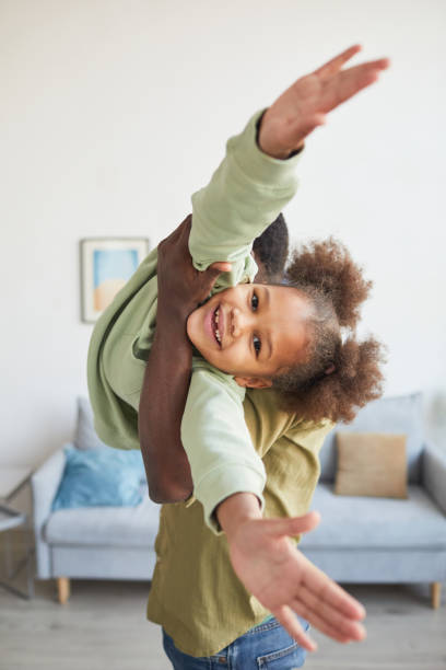 istock Happy African American Girl Playing with Dad 1311219961