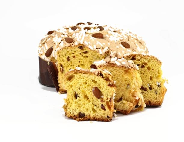 istock Colomba Pasquale, typical italian easter cake,with some slices in front. The name means Easter Dove in english language, due to its shape 1311220871