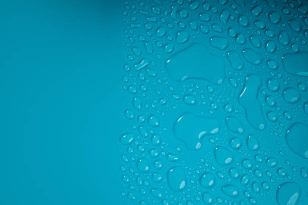 istock Water Drops on Blue Background. World Water Day Concept. Droplet Texture Surface. Environment Care. CSR, Corporate Social Responsibility or CSC, Corporate Social Contribution 1311221100