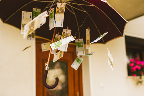 Fake money bills under the umbrella