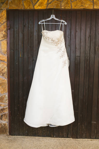 istock Wedding dress hanging 1311221397