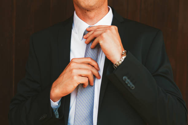 istock Businessman fixing his tie 1311221417