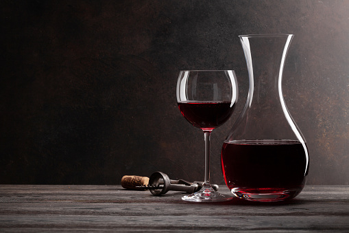 Red wine bottles with glass isolated on white (Click for more)