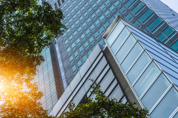 istock modern office building with green leaves 1311225432