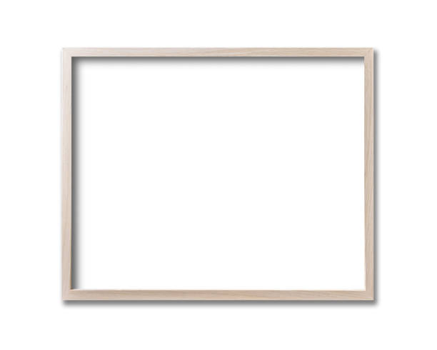 istock Wooden picture frame hanging on a white wall 1311225532