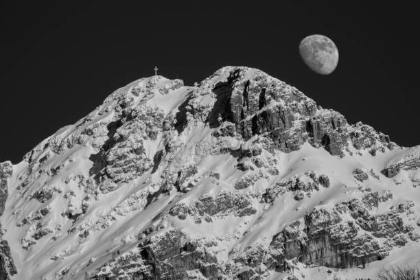 istock THE MOON APPEARS ON MOUNT RESEGONE 1311227342