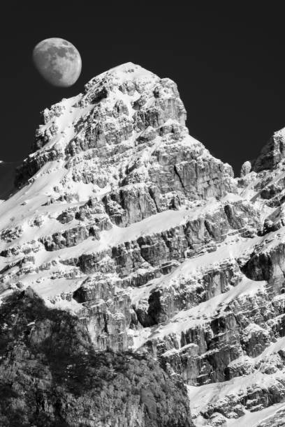 istock THE MOON RISES ABOVE MOUNT RESEGONE 1311227378