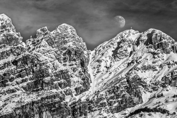 istock THE MOON APPEARS ON MOUNT RESEGONE 1311227416