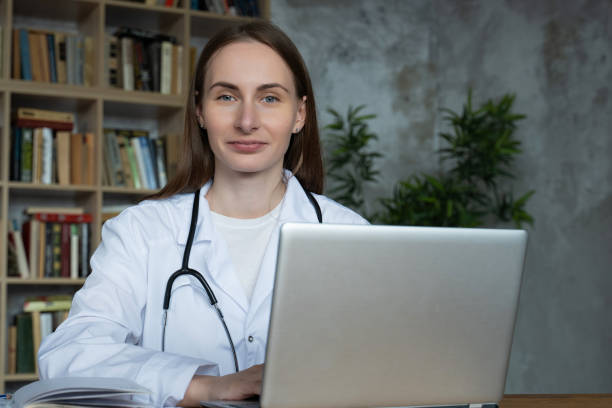 istock Woman doctor using on her laptop computer in medical office 1311227538