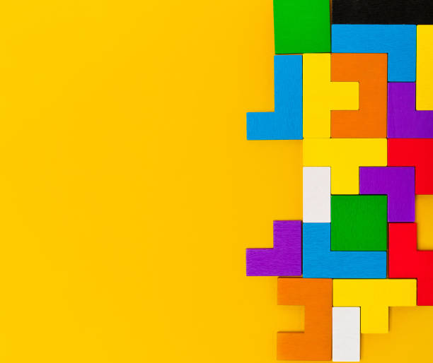 istock Geometric shapes of different shapes and colors. A developing constructor made of wood. Conceptual background and place for text 1311227736