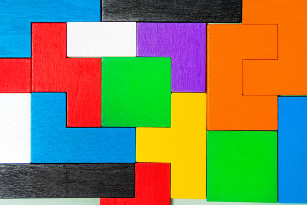 istock Geometric shapes of different shapes and colors. A developing constructor made of wood. Conceptual background and place for text 1311227757