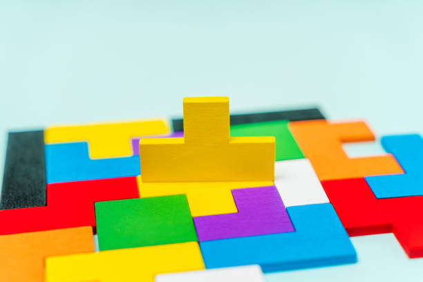 istock Geometric shapes of different shapes and colors. A developing constructor made of wood. Conceptual background and place for text 1311227793