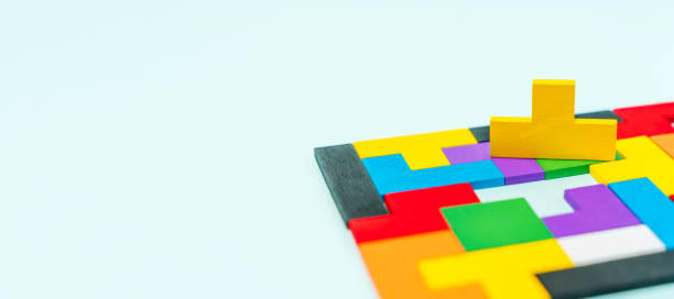 istock Geometric shapes of different shapes and colors. A developing constructor made of wood. Conceptual background and place for text 1311227809